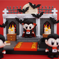 Vampire Castle 3D printed playset with chibi vampire figure, bats, candles, and full moon